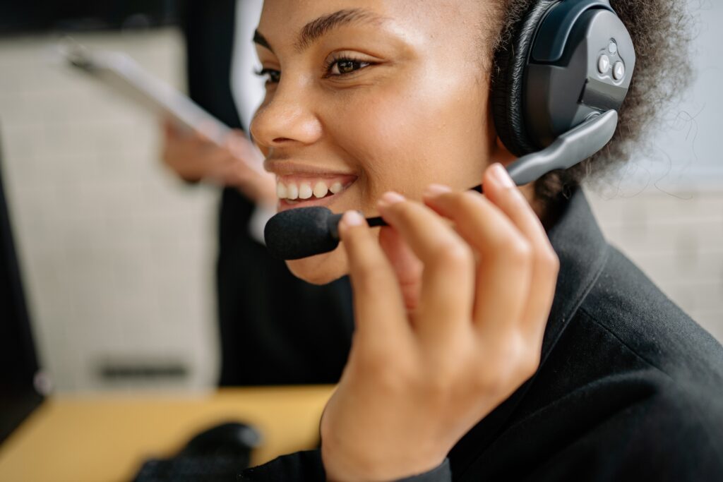 smiling law firm receptionist talks on headset
